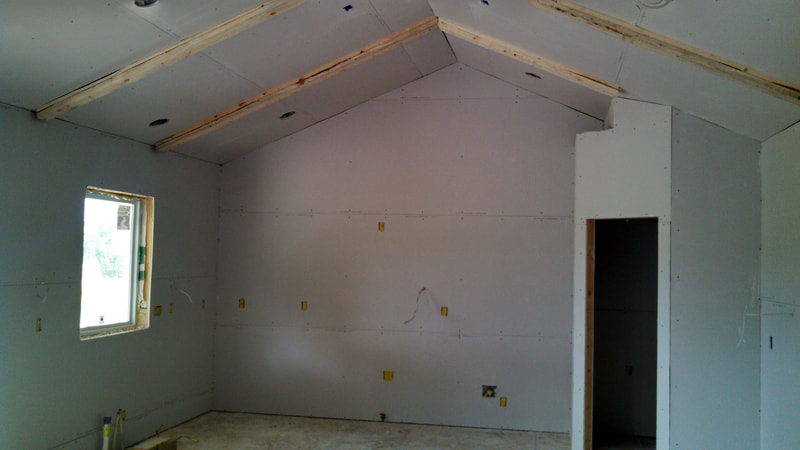 Kitchen drywall with exposed beams