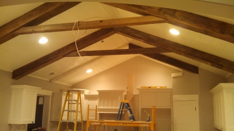 Exposed beams over kitchen